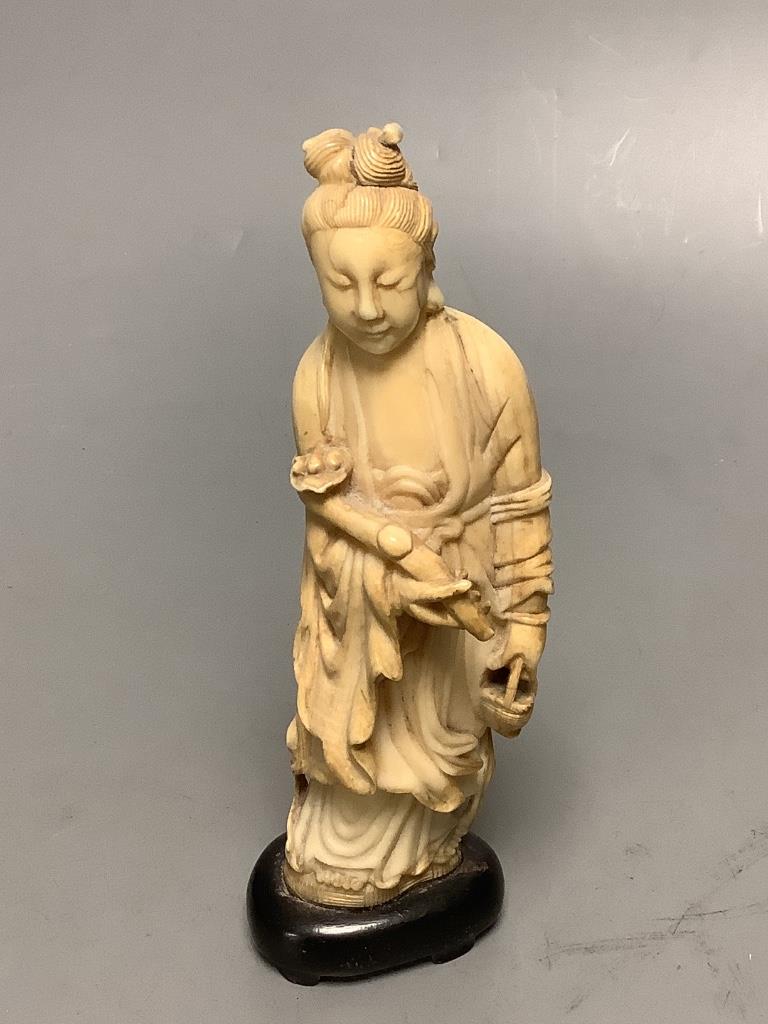 A Chinese ivory figure and a bowenite jade carving